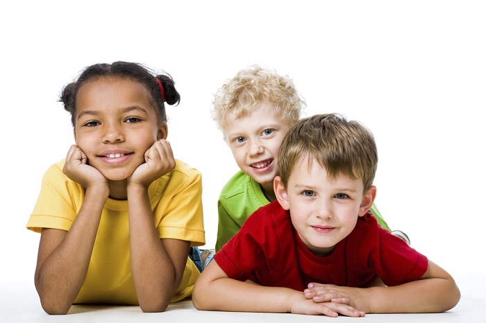 three children lying on the floor