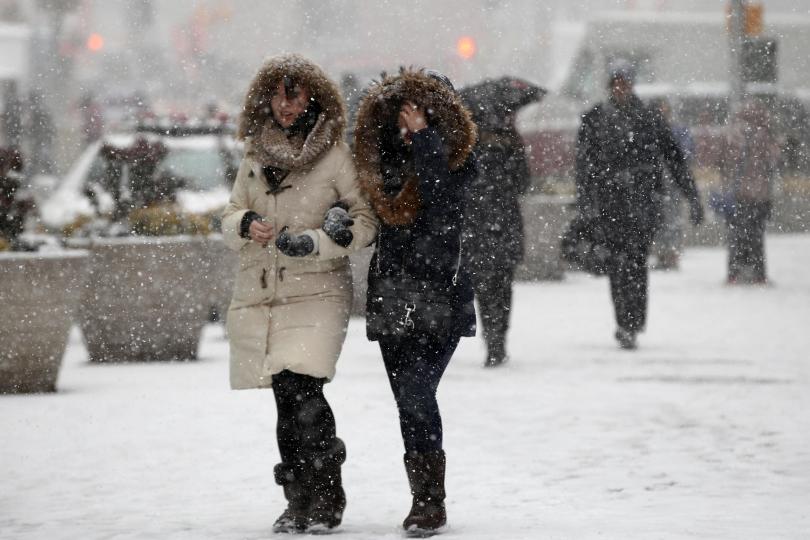 Women Walking In Blizzard