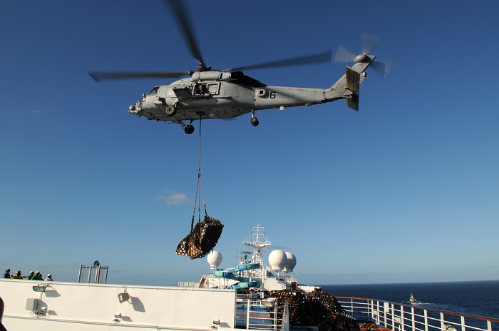 HH-60H delivering relief supplies to Carnival Splendor in 2010, one of the worst cruise ship disasters