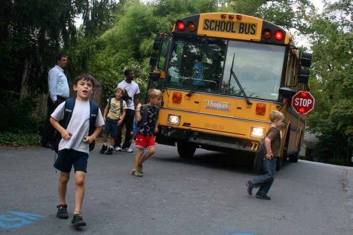 kids getting off school buskids getting off school bus