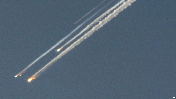 Space Shuttle Columbia breaking apart as it re-enters the Earth's atmosphere