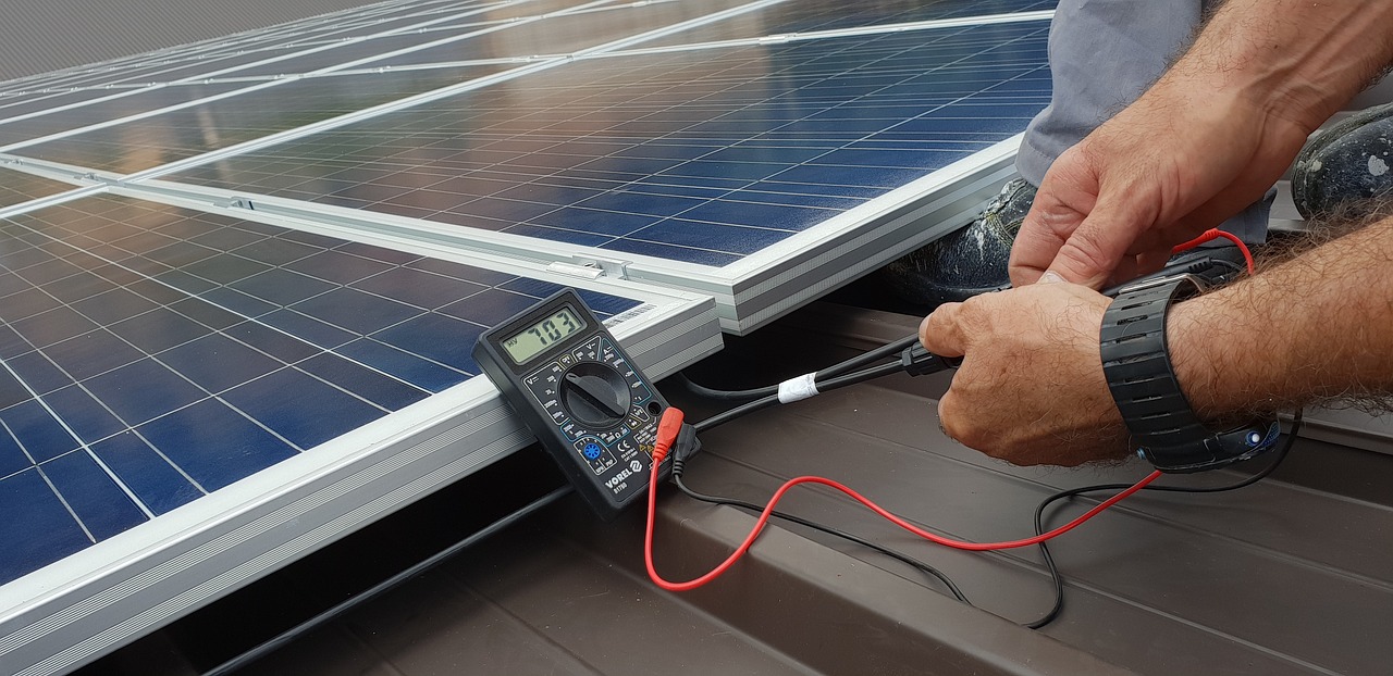 technician installing solar panels